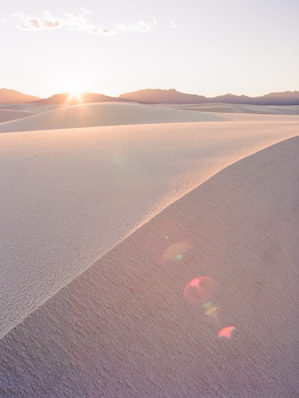 Sun flare on the dunes in White Sands National Park, New Mexico
