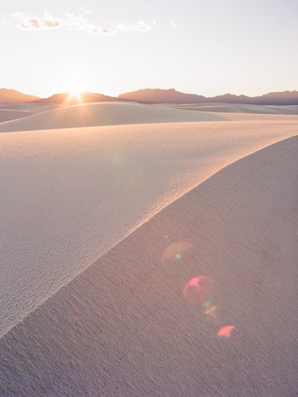 Sun flare on the dunes in White Sands National Park, New Mexico