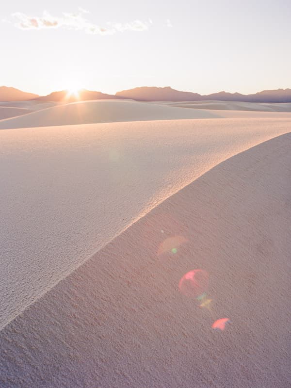 Sun flare on the dunes in White Sands National Park, New Mexico