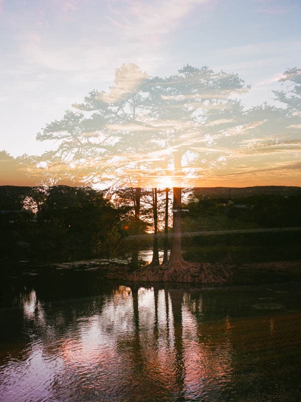 Double exposure of sunrise at the Guadalupe River in Canyon Lake, Texas