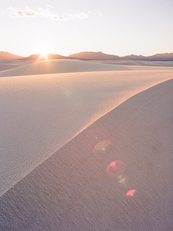 Sun flare on the dunes in White Sands National Park, New Mexico
